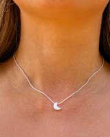 -Silver
-Crescent moon detail
-Hook clasp
-Medium length 
SILVER CRESCENT CHARM NECKLACE 